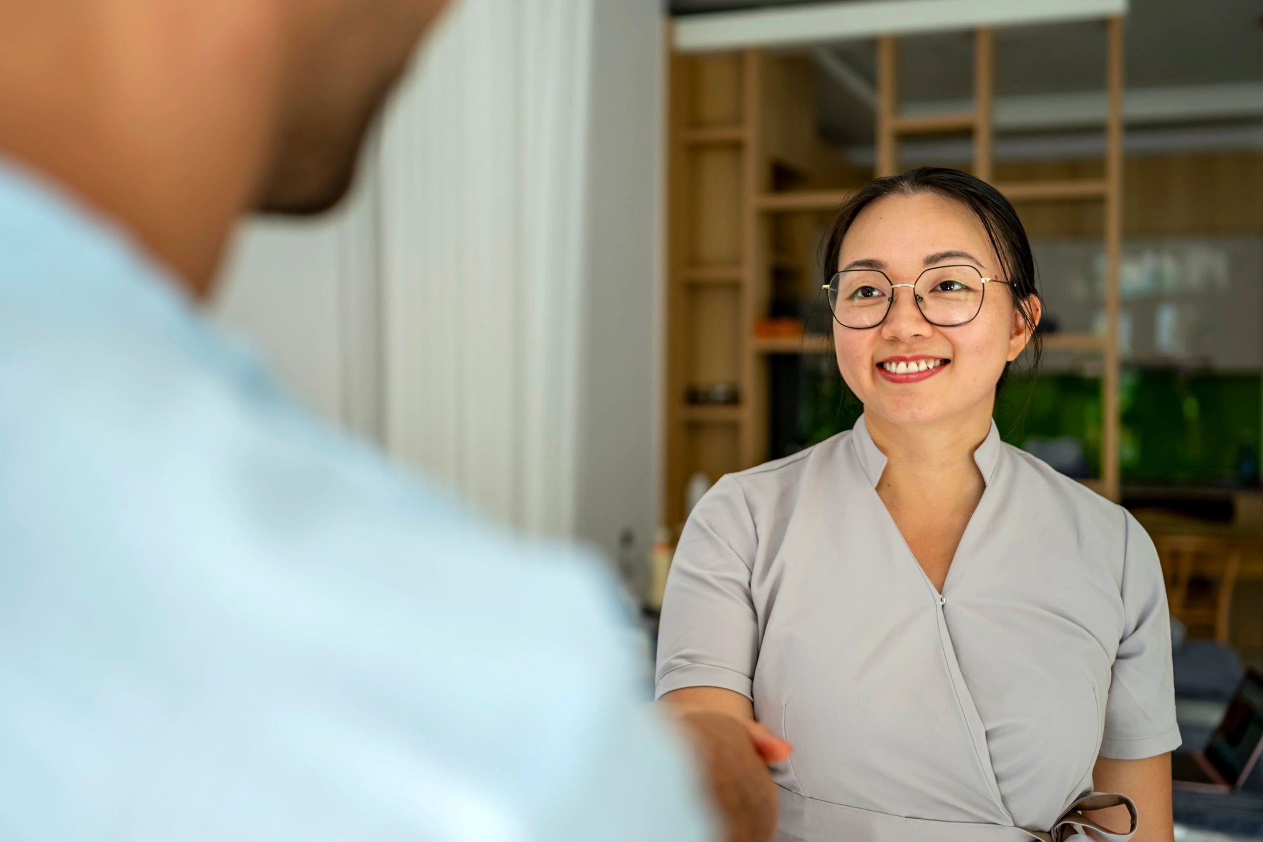 Business handshake in a professional office setting