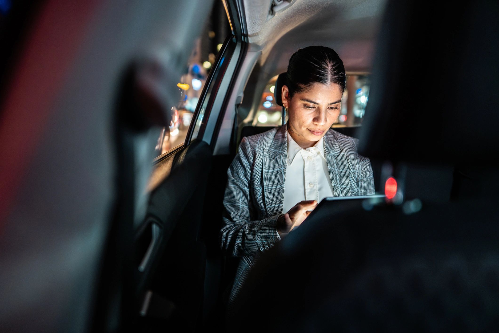 Business professional planning market entry on a tablet